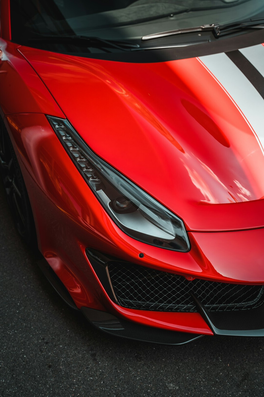 Red car with glossy paint close up